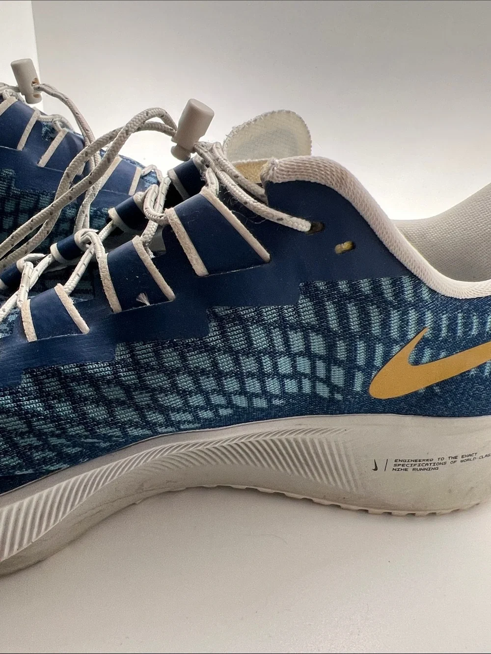 Nike Men’s Blue Sneakers with Gold Swoosh